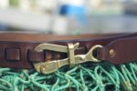 Pelican Hook Leather Sailing Belt on Walnut with Bronze Hook