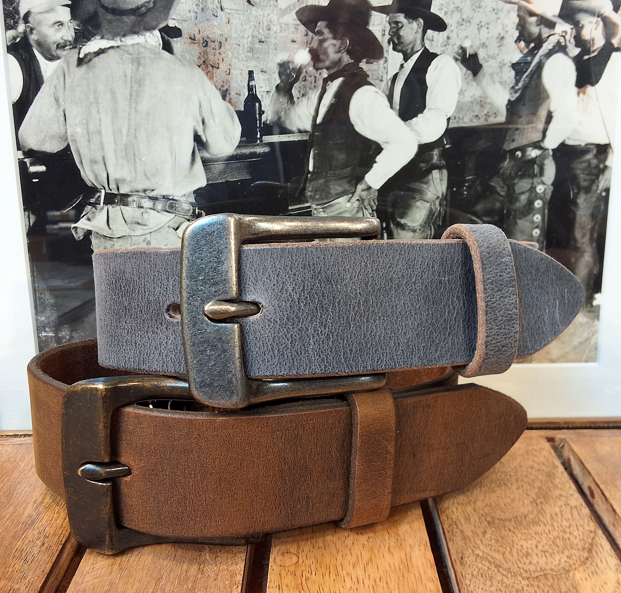 Merek Distressed Leather Belt In Stone Distressed with Antique Silver Buckle and Mustang Distressed with Antique Brass Buckle