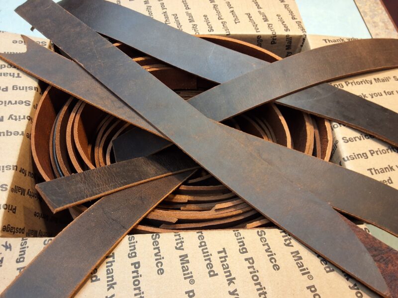 Box of Brown Distressed Belt Weight Belt Leather Scrap Pieces